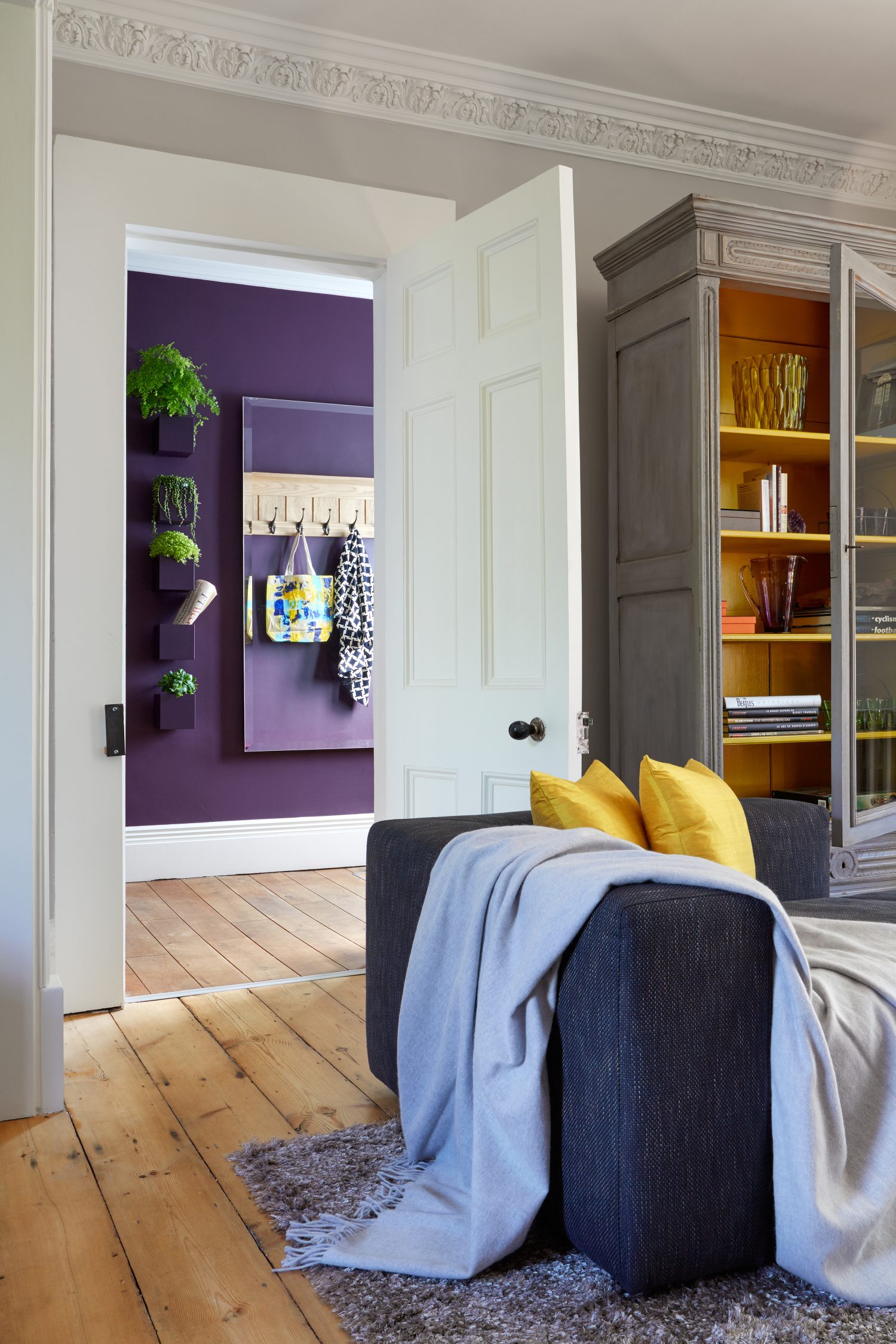 Happy House by Daniel Hopwood – antique armoire and bright yellow interior. Eclectic design