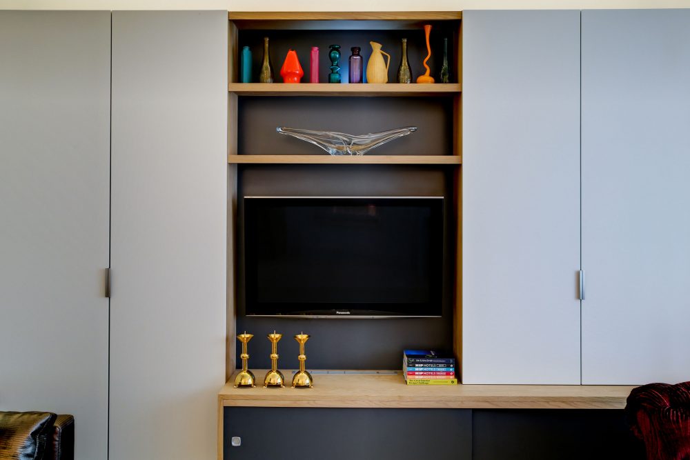 Glamour’s Back! by Daniel Hopwood – grey TV unit with colourful detail. Interior design consultation, Maida Vale